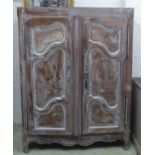 ARMOIRE, early 19th century French Provincial oak and later wash painted with two panelled doors