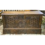 COFFER, 17th century Spanish chestnut with hinged top above a duck and roundel carved front, 83cm