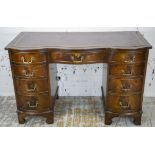 SERPENTINE DESK, Georgian style, mahogany, with burgundy leather top above nine drawers, 75cm H x