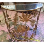 DEMI LUNE CONSOLE TABLE, gilt metal foliate design with mirrored top, 77cm H x 86cm W x 35cm D.
