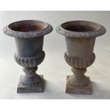 GARDEN URNS, a pair, Victorian campana form, cast iron with acanthus moulded rims, 55cm H x 39cm