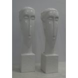 CONTEMPORARY SCHOOL BUSTS, a pair, glazed ceramic, 61cm H. (2)