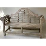 LUTYENS STYLE GARDEN BENCH, silvery weathered teak and of substantial slatted construction after a