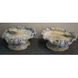 BIRD BATHS, lead of scallop shell form on rocky bases, 17cm H x 36cm x 36cm. (2)