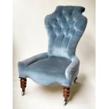 SLIPPER CHAIR, Victorian, walnut, with sapphire blue buttoned velvet, on white ceramic castors, 60cm