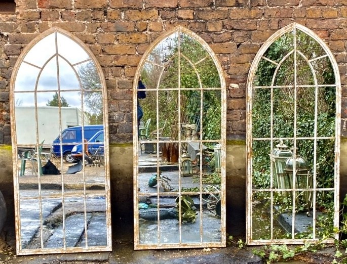 ARCHITECTURAL GARDEN WALL MIRRORS, a set of three, Gothic style arch toped design, 158cm x 66cm. (3)