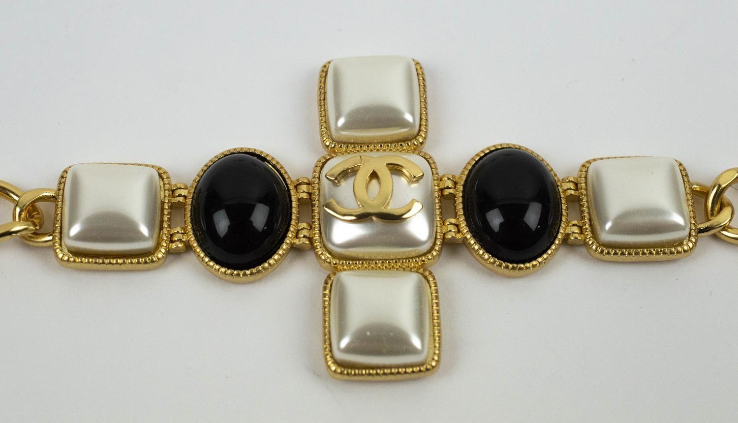 CHANEL BLACK CABOCHON SET, CC cross bracelet with a pair of faux pearl and crystal sett CC earrings. - Image 5 of 7