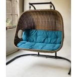GARDEN SWING, outdoor use, grey plasticised basketwork, with blue cushions and floor standing frame,