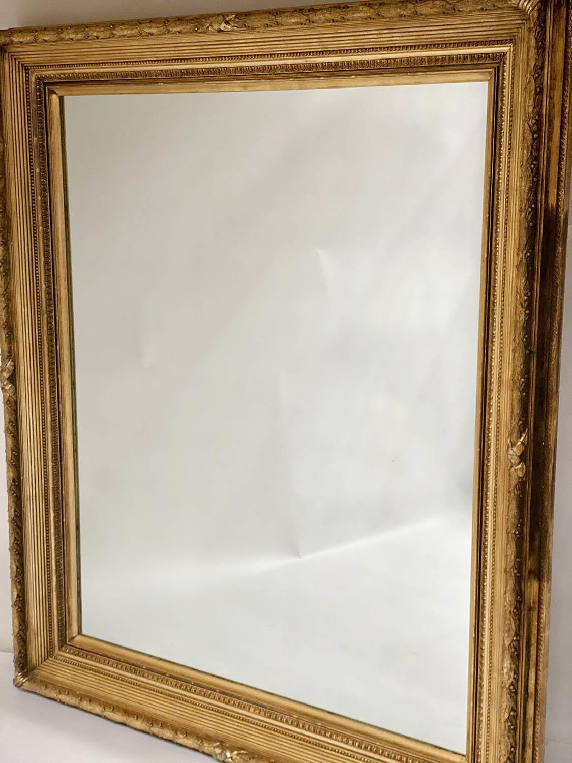 WALL MIRROR, 19th century giltwood and gilt composition with trailing leaf berry frame, crossed