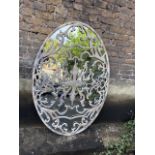 ARCHITECTURAL GARDEN WALL MIRROR, oval with Trellis detail across plate, 153cm x 104cm.