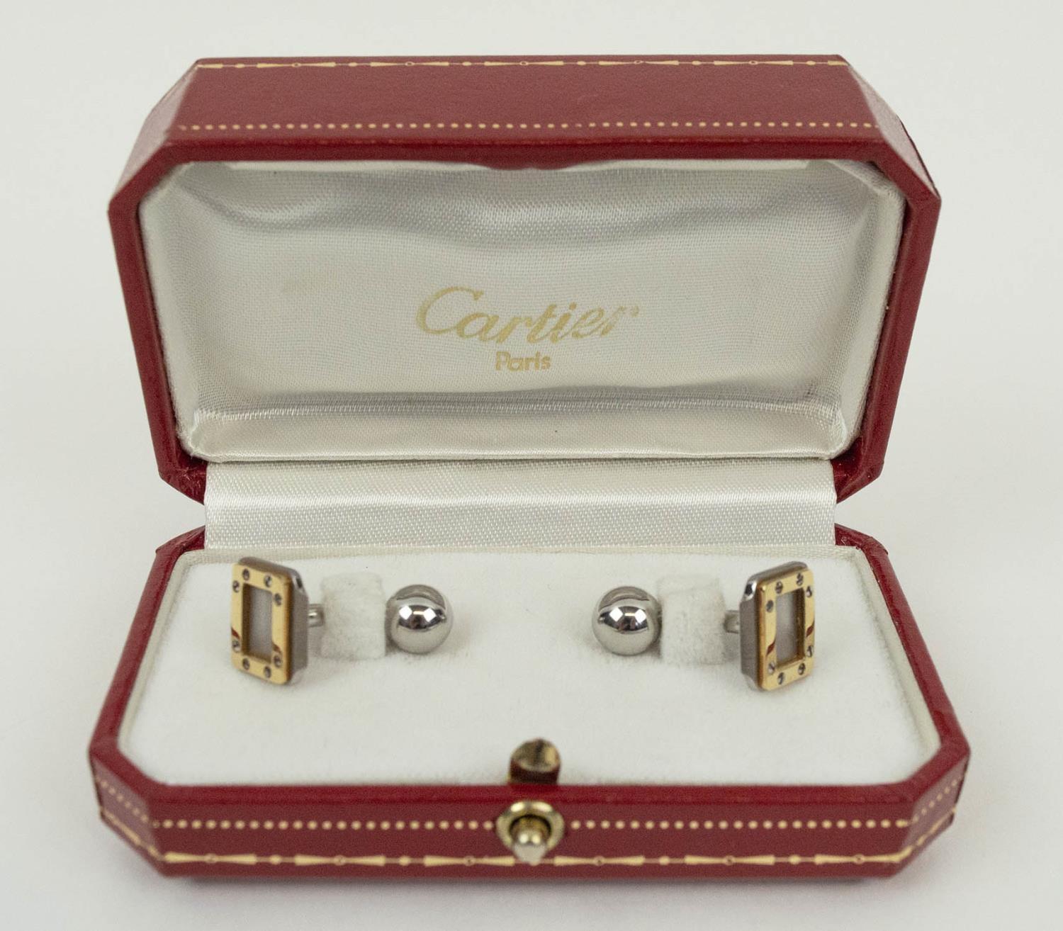 CARTIER CUFFLINKS, Santos collection, stainless steel with 18ct gold border set with screw motif