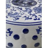 CHINESE STOOLS, a pair, pierced blue and white ceramic of barrel form, 45cm H. (2)