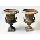 GARDEN URNS, a pair, Victorian cast iron of campana form with egg and dart frieze and lion mask