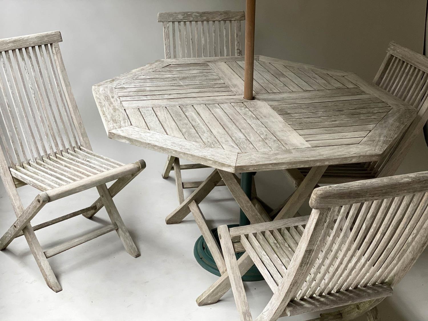 GARDEN TABLE AND CHAIRS, silvery weathered teak, octagonal (folding) together with four finely - Image 2 of 7
