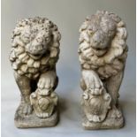 GARDEN/GATE LIONS, a pair, weathered reconstituted stone of lions seated each with shield