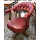 DESK CHAIR, Victorian mahogany in red leather with swivel and reclining action on quadraform