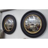 CONVEX WALL MIRRORS, a pair, Regency style, ebonised frame with gilt detail, 73cm diam. (2)