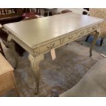 WRITING TABLE, in a distressed painted finish with three frieze drawers and cabriole supports,