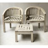 'BANANA' GARDEN ARMCHAIRS, a pair, weathered teak each with bow back together with a 'Lister' low