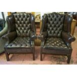 WING ARMCHAIRS, a pair, Georgian style in dark close nailed leather, 108cm H x 86cm. (2)