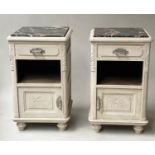 ART DECO BEDSIDE CABINETS, a pair, French oak and silvered metal mounted with carved detail each