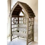 GAZEBO/ARBOR, weathered treated pine with two seat slatted arbor enclosed by arched boarded roof and