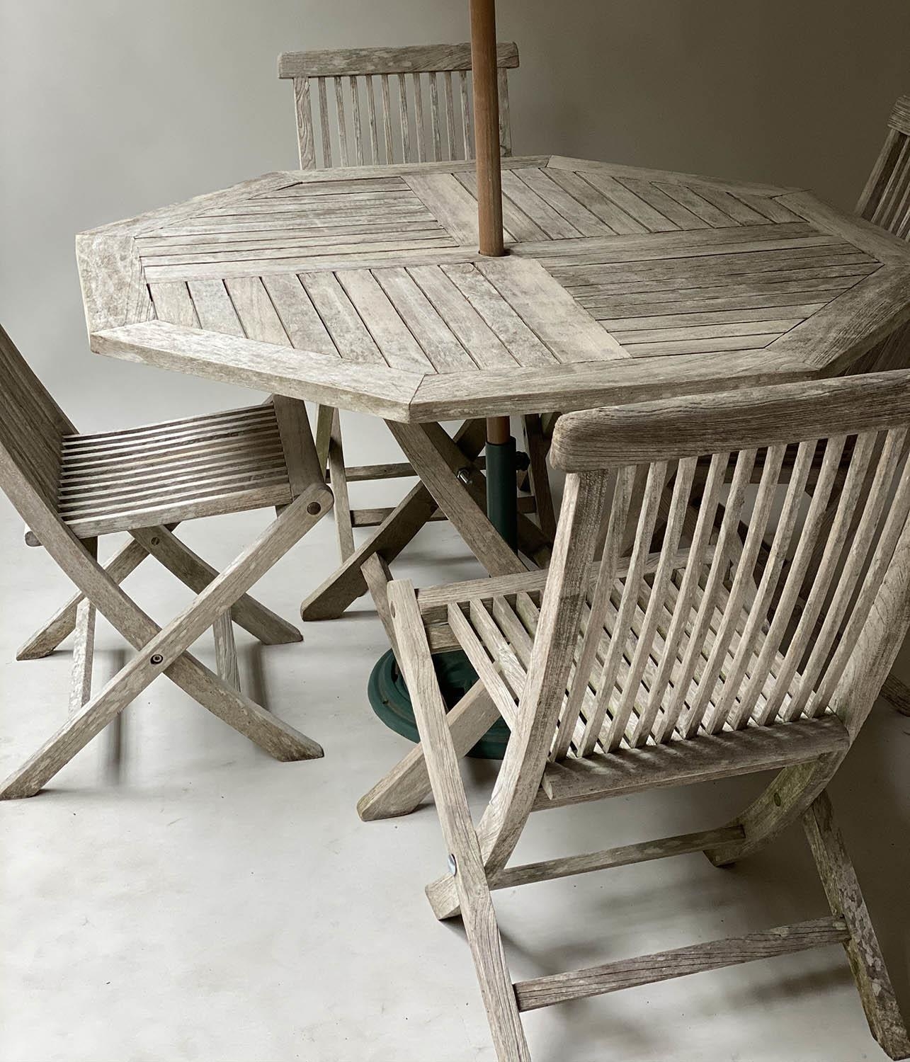 GARDEN TABLE AND CHAIRS, silvery weathered teak, octagonal (folding) together with four finely - Image 5 of 7