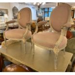 FAUTEUILS, a pair, late 19th century French with carved and later painted wash showframes in pale