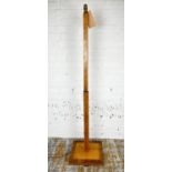 STANDARD LAMP, Art Deco birds-eye maple and walnut, circa 1930, raised on a square plinth base,