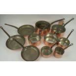 BATTERIE DE CUISINE, French copper pans with iron handles, comprising seven saucepans and three