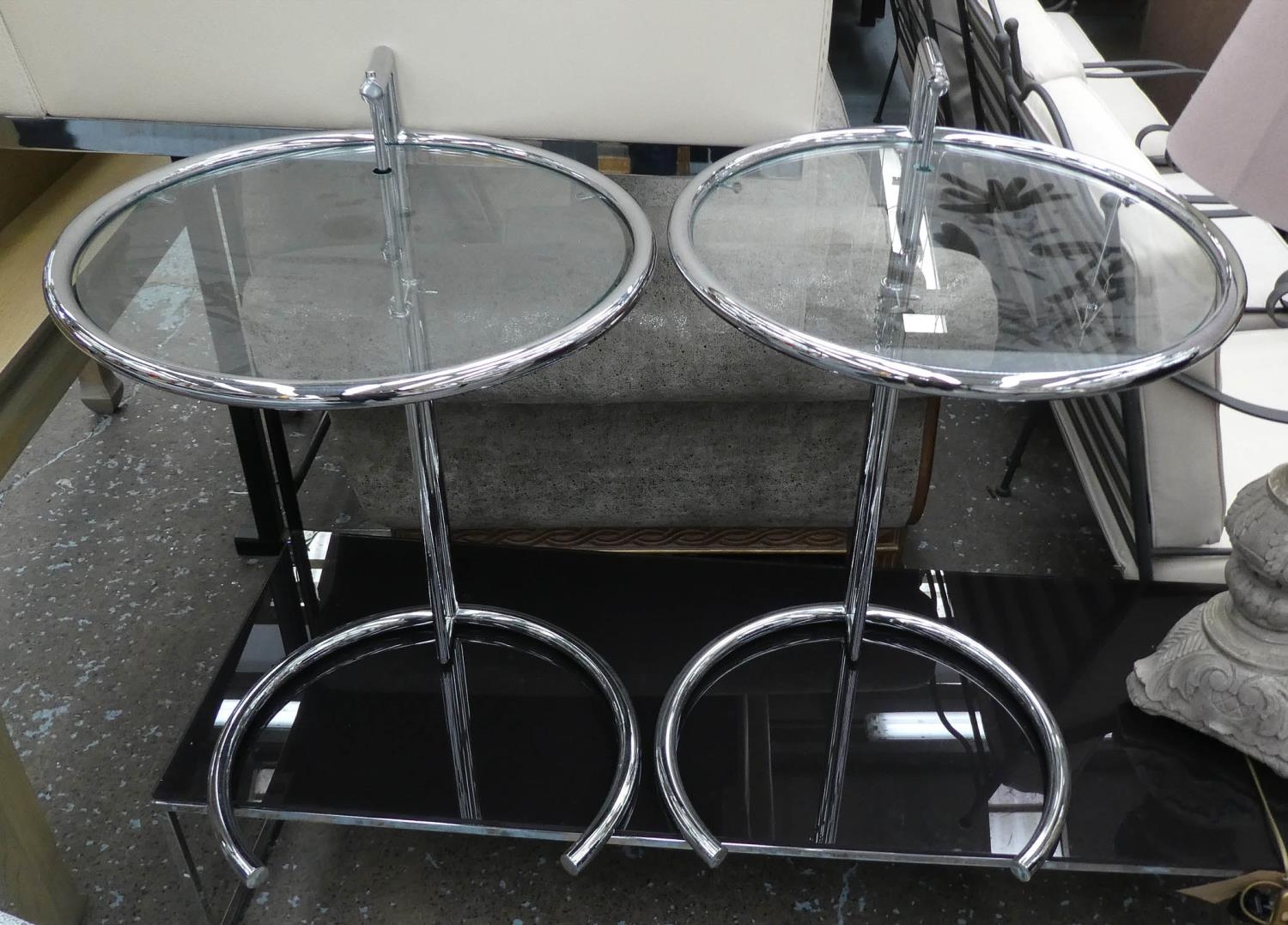 AFTER EILEEN GRAY E1027 STYLE SIDE TABLES, a set of three, 77cm H x 51cm diam at tallest. (3)
