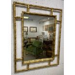 FAUX BAMBOO WALL MIRROR, 1970's Italian design brass, 90cm x 70cm.