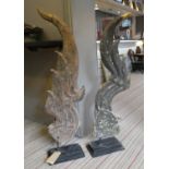 CARVINGS, a pair, from Andrew Martin, on stands, 125cm H. (2)