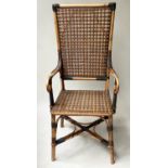 MAPLE & CO ELBOW CHAIR, early 20th century bamboo and rattan with scroll arms, label for 'Maple &