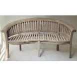 BANANA GARDEN BENCH, weathered teak, slatted with bow back and rounded arms, 166cm W.