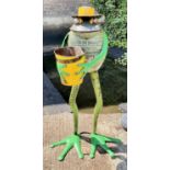 MR FROG, holding a planter, made from upcycled metal, 115cm H x 59cm x 38cm L.