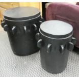 DRUM TABLES, a graduated pair, ebonised finish, 57cm H x 52cm diam.