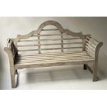 LUTYENS STYLE GARDEN BENCH, weathered teak slatted with scroll arms after a design by Sir Edwin