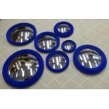 CONVEX WALL MIRRORS, a set of seven, electric blue flocked finish, various sizes, 24cm Diam approx