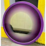 CIRCULAR WALL MIRROR, circa 1980's, with purple lacquered frame and gradient tinted plate, 141cm