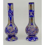 HUQQA BASES, a near pair, early 20th century Bohemian glass, blue ground with enamel decoration of