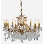 CHANDELIER, 1950's French style, gilt metal and lead crystal, 12 branch, 88cm diam.