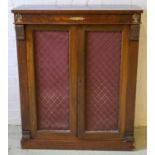 SIDE CABINET, 19th century mahogany with two brass grille and fabric lined doors enclosing