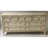 FAUX BAMBOO LOW CHEST, painted with seven drawers and splay supports, 147cm W x 79cm H x 47cm D.