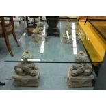 LOW TABLE, the glass top on four Chinese dogs of fo supports, 96cm x 157cm x 48cm H.