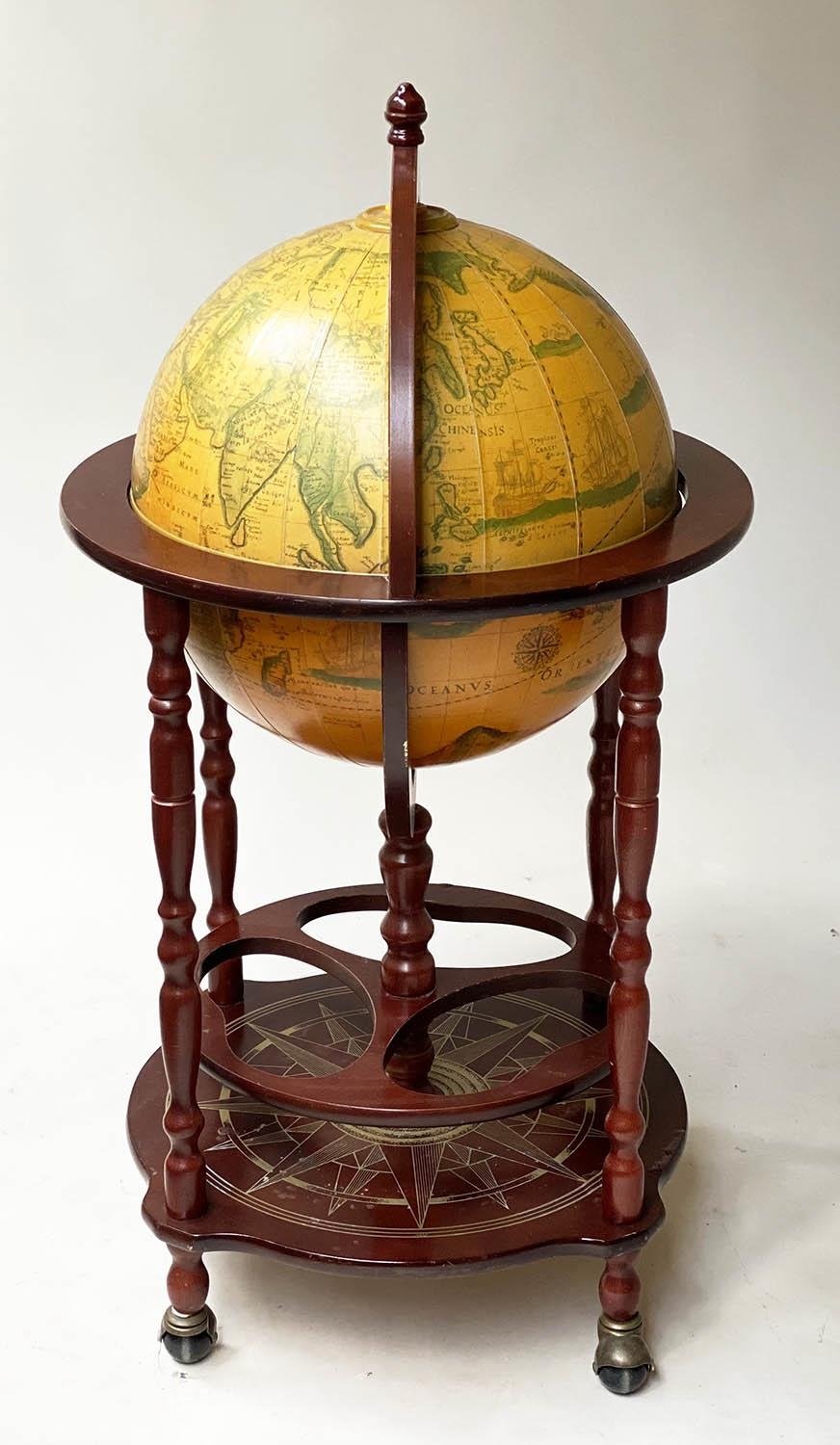 GLOBE COCKTAIL CABINET, in the form of an antique terrestrial globe on stand with rising lid and