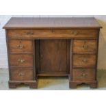 KNEEHOLE DESK, George III mahogany with seven drawers and recessed door, 75cm H x 106cm x 49cm. (