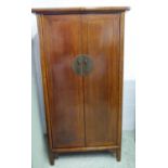 CHINESE MARRIAGE CABINET, elm with two panelled doors enclosing a rail, shelves and two short