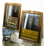 WALL MIRRORS, a pair, rectangular ebonised and gilt bevelled, 76cm W x 110cm H. (2)