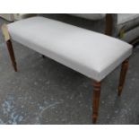 WINDOW SEAT, neutral upholstered finish on reeded supports, 98cm x 40cm x 50cm.